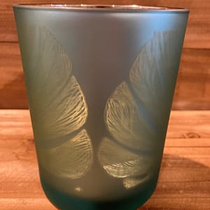 Turquoise glass candle holder with leaf design