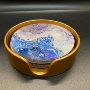 Set of four glass marble design coasters in holder