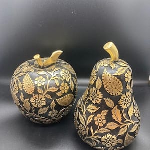 Black and gold apple and pear