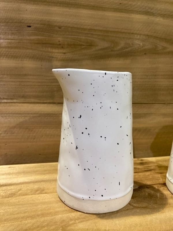 Ceramic white speckled handleless milk jug