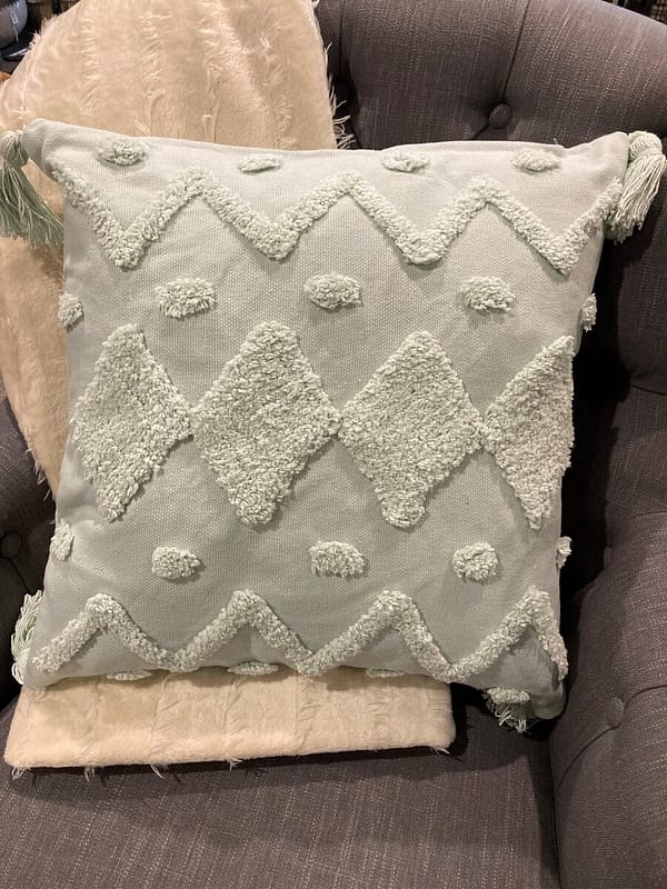 Mint green cushion with feather filled insert