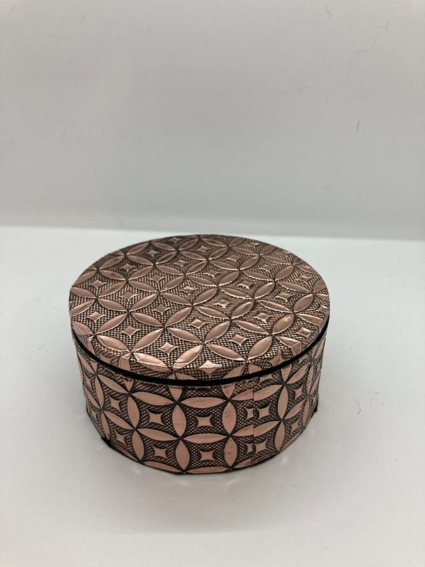 Rose gold coloured trinket pot with removeable lid