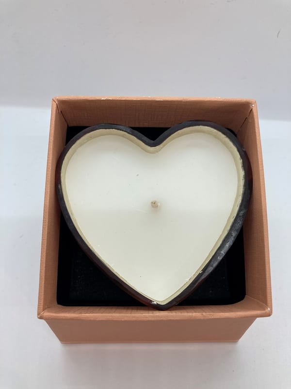 Glass heart shaped pot with candle